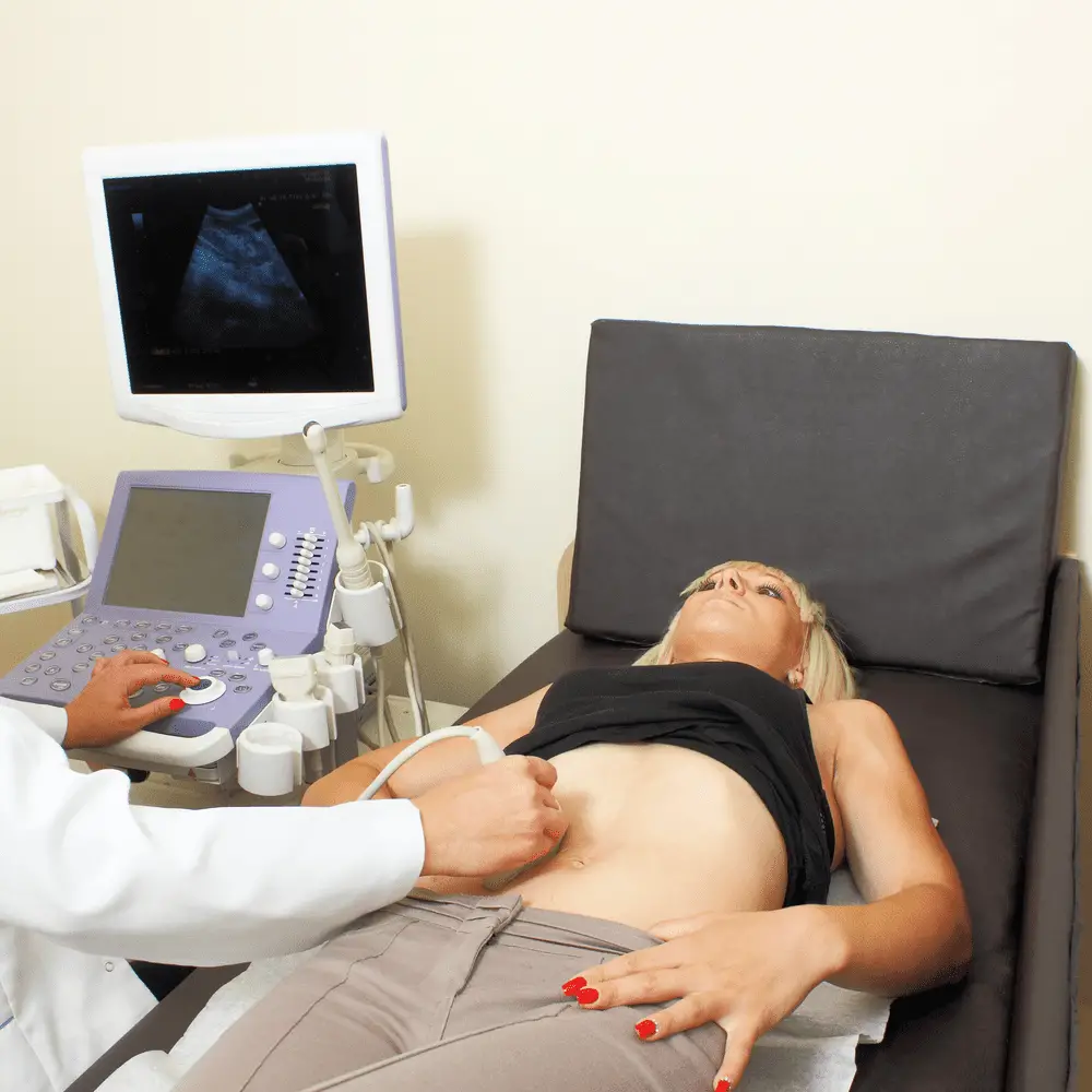 woman checked through ultrasound machine