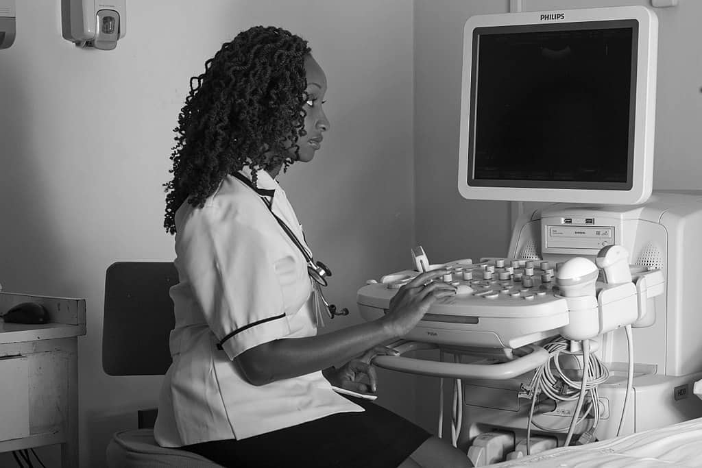 nurse beside an hospital device