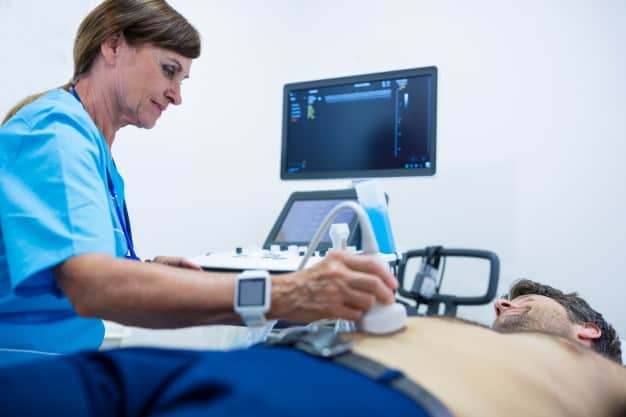 man getting ultrasound abdomen from doctor