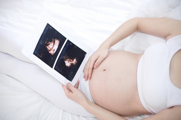 pregnant lady with ultrasound images