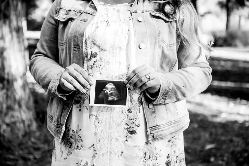 Woman holding ultrasound result